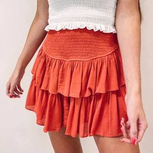 Mustard Seed Smocked Ruffle Mini Skirt with Shorts Rust